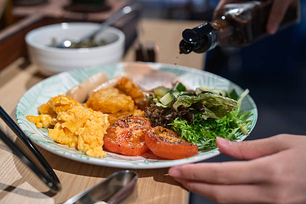 istock Breakfast Plate with Scrambled Eggs, Sausages and Fresh Salad 2243130400