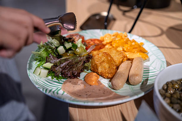 Breakfast Plate with Scrambled Eggs, Sausages and Fresh Salad