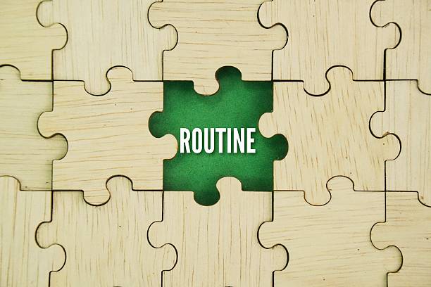 istock Wooden puzzle with the word Routine. 2243132471