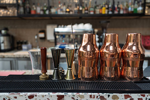 istock Copper Cocktail Shakers and Bar Tools on Countertop 2243134393