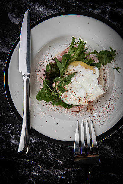 istock Gourmet Poached Egg Breakfast on Dark Marble 2243136646