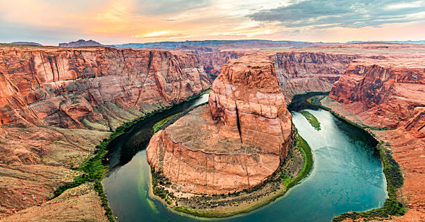 istock Wide View of Horseshoe Bend Sunset Glow on Red Cliffs 2243137616