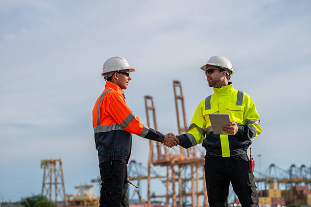istock Industrial engineer workers operations marine port cranes loading and unloading of cargo ships global trade and supply chain import export environment monitoring responsible global economy. 2243139763