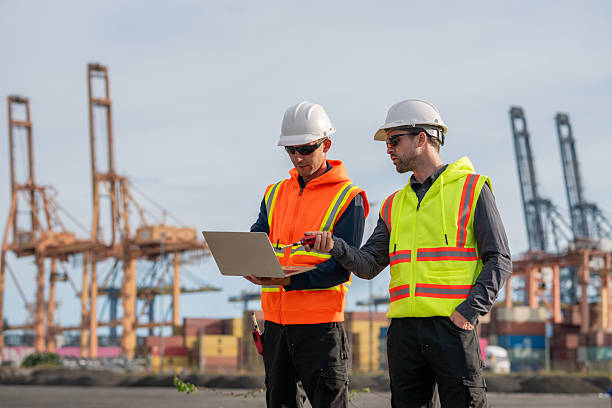 istock Industrial engineer workers operations marine port cranes loading and unloading of cargo ships global trade and supply chain import export environment monitoring responsible global economy. 2243139863