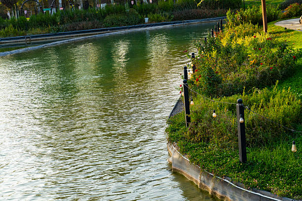 Empty viewing platform beside lake with green city park landscape