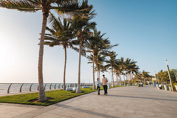 istock Cheerful Young Couple Strolling Along Scenic Waterfront 2243148792