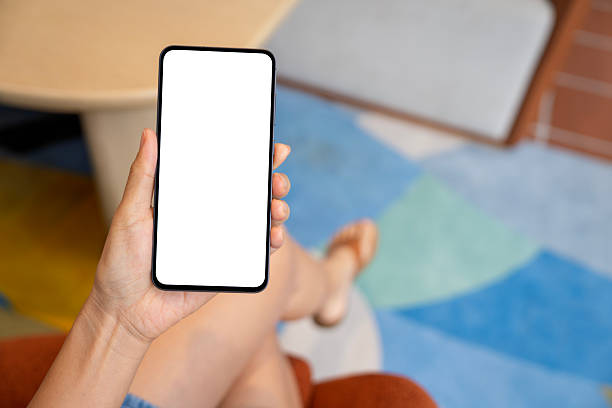 istock A woman using smartphone with blank screen in modern living space 2243150196