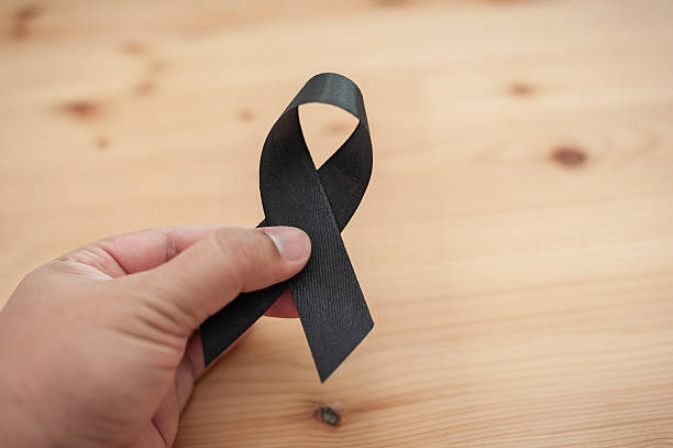istock Funeral and mourning with black ribbon emotional tribute personal reflection intimate setting 2243153037