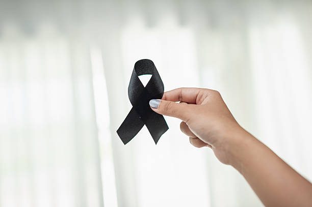 istock Honoring memories a black ribbon funeral tribute intimate setting emotional reflection 2243153086