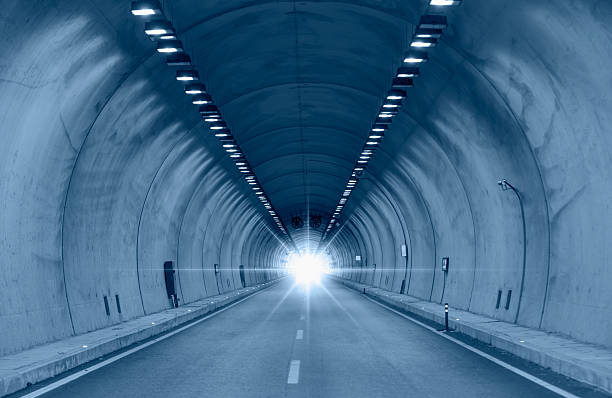 istock Highway road tunnel with car light 2243154704