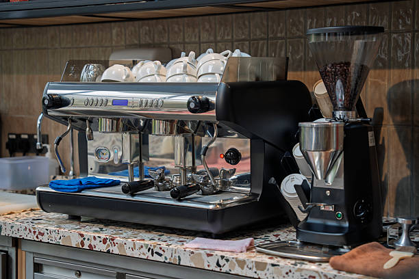 istock Professional espresso machine and coffee grinder at bar counter 2243155668