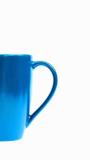 istock Close up of a bright blue ceramic mug handle against a white background 2243161821