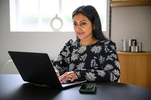 istock British Pakistani businesswoman working from home using laptop 2243163254