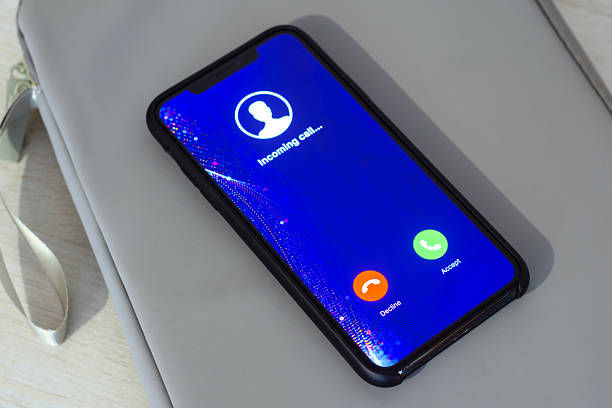 istock Smartphone displaying an incoming call screen with Decline and Accept buttons. Concept of communication and social networking. 2243163388