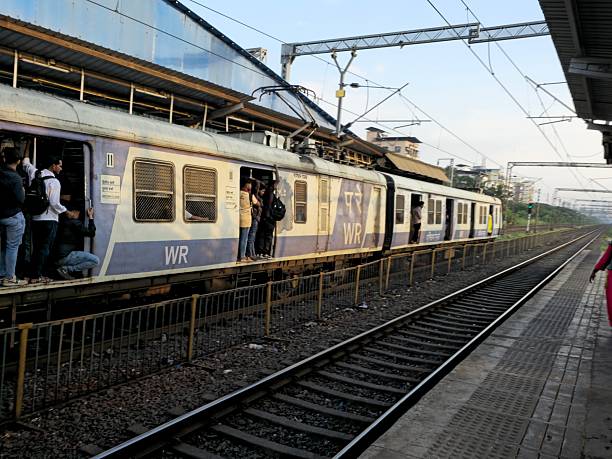 Mumbai, India - October 23, 2025 : A lot of female passengers stood at the train door and the door was opened. Every day about 8 millions passengers pass through the station.