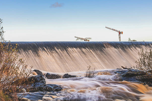 istock Artificial fish ladder in a river with water flowing over concrete steps, designed to help wild salmon migrate upstream through the dam, symbol of ecological restoration 2243163643