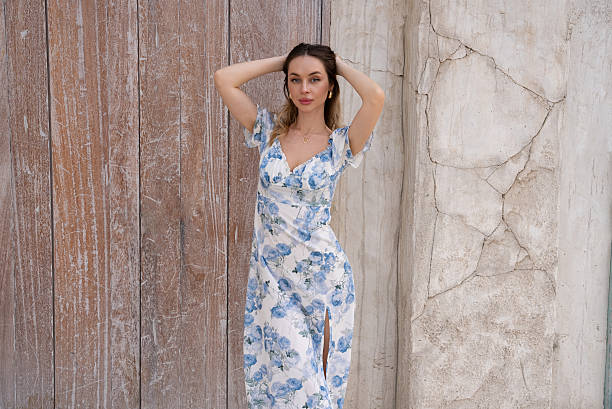 istock Fashion Model Posing Gracefully Near Rustic Door 2243165464