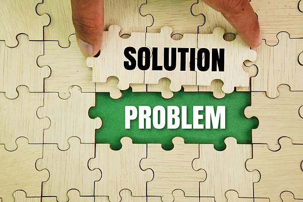 istock Wooden puzzle and problem with the word solution in the middle. 2243168916