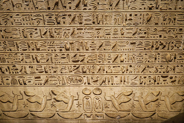 istock Egyptian hieroglyphs stone background. Egyptian hieroglyphics stone background in Egypt 2243173912