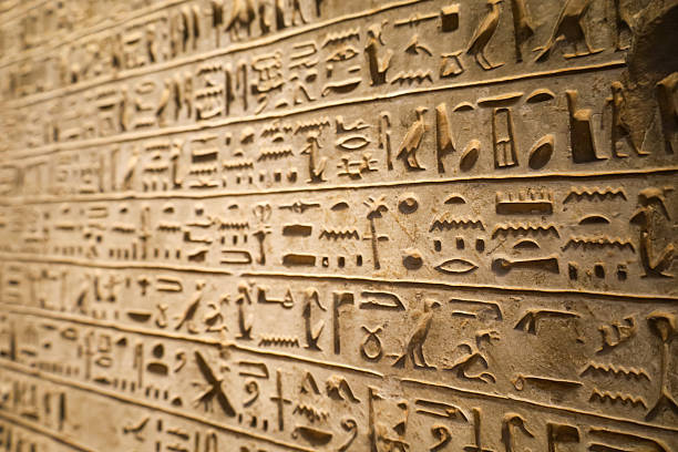 istock Egyptian hieroglyphs stone background. Egyptian hieroglyphics stone background in Egypt 2243174509