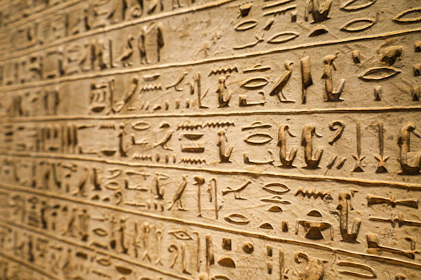istock Egyptian hieroglyphs stone background. Egyptian hieroglyphics stone background in Egypt 2243174524