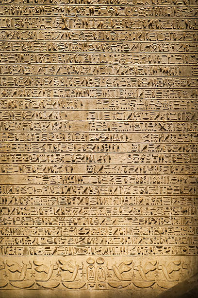 istock Egyptian hieroglyphs stone background. Egyptian hieroglyphics stone background in Egypt 2243174530