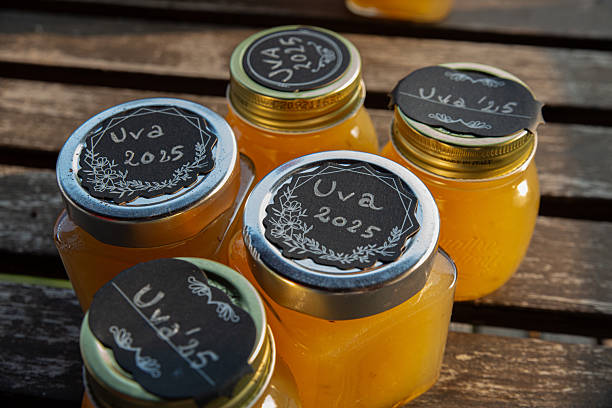 istock Artisanal Honey Jars Outdoor Display - Rustic Wooden Table Setting 2243175968