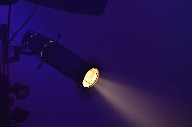 istock Spotlight casting light in a dark room with purple walls during an evening event 2243176827