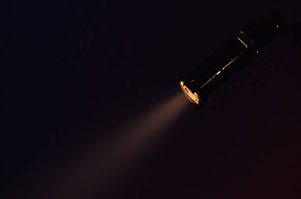istock Bright spotlight illuminates a dark space showcasing focused beam of light 2243176847