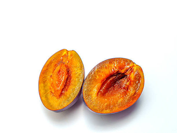 istock Juicy Stone Fruits: Halved and Whole Plums for Culinary Use 2243178981