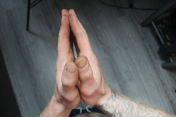 hands folded palms to each other for prayer.
