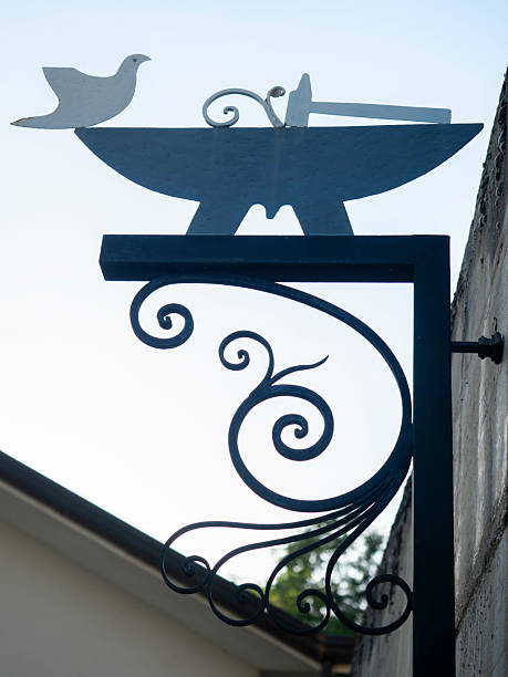 Rustic iron sign hanging from a wooden wall in Akranes, Iceland