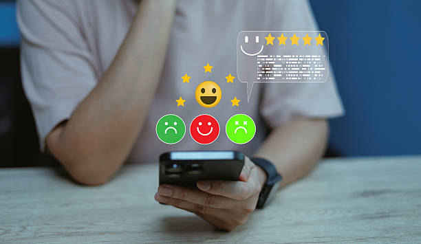 istock Person using smartphone with emotion icons five-star rating positive through feedback virtual interface representing customer satisfaction, online review system, experience concept digital marketing 2243183486