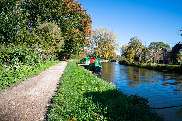 istock River Lea Navigation at Enfield Lock with Canal Boat on Sunny Day 2243190696