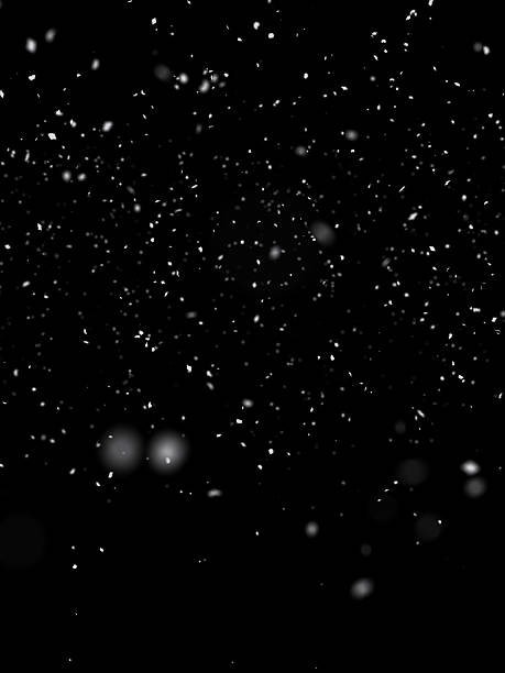 istock Vertical composition of falling snow particles on a black backdrop 2243191724