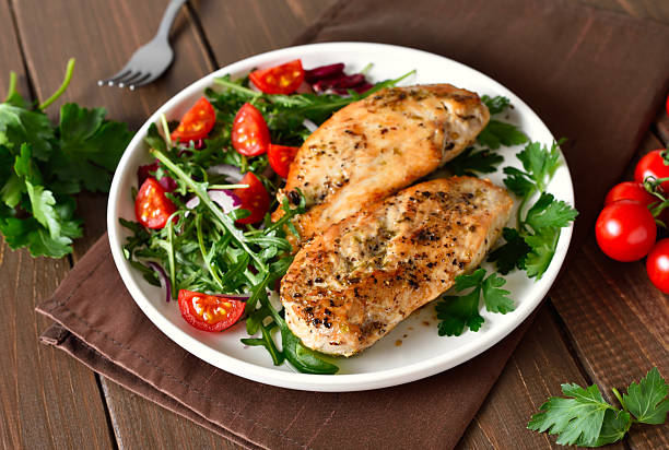 istock Oven baked chicken breast and vegetable salad 2243191818