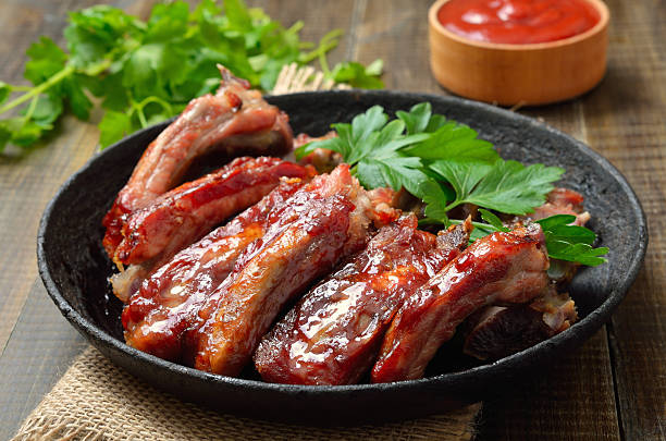 istock Appetizer roast sliced pork ribs in frying pan 2243192688