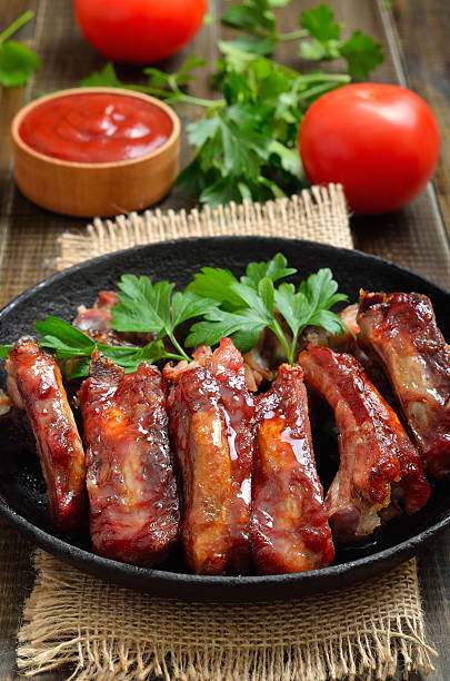 istock Appetizer roast sliced pork ribs in frying pan 2243192816