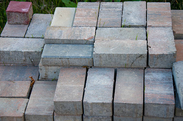 a large, thick, flat piece of stone, concrete, or wood, typically rectangular.