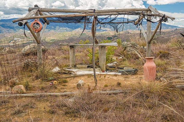 istock What is left of an abandoned wooden structure with two pottery crocks 2243199470