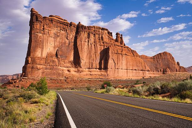 istock Desert rock scenery, sunlit canyon with towering sandstone formations and sparse vegetation. Arches Nationalpark, Moab in Utah US. 2243202803