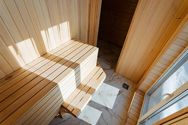 istock This beautifully crafted sauna is made of highquality wood, featuring a comfortable bench and a window that lets in natural light, enhancing its warm, inviting atmosphere 2243212812