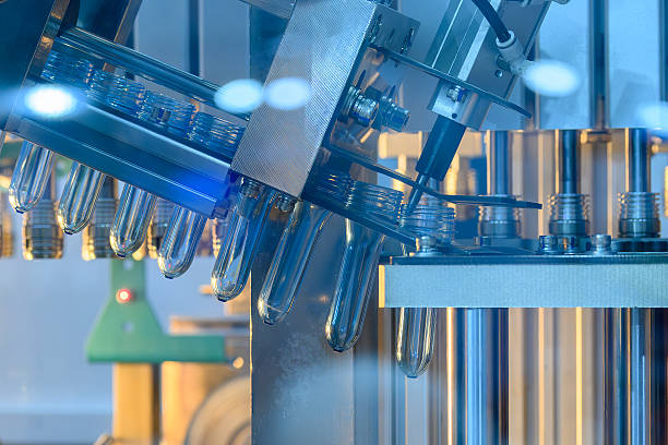 istock Close up scene the plastic bottle preform shape on the conveyor belt in the blue scene. 2243212865