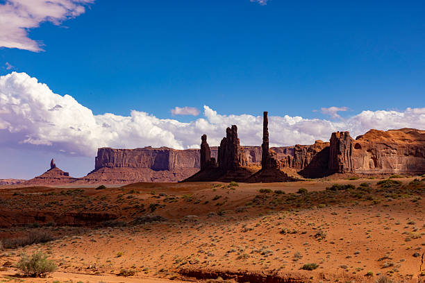Monument Valley is a striking desert landscape located on the Arizona–Utah border in the United States. Known for its towering sandstone buttes, mesas, and vibrant red hues, it has become an iconic symbol of the American West. The valley lies within the Navajo Nation Reservation and holds great cultural and spiritual significance for the Navajo people. Many films, photographs, and advertisements have featured its breathtaking scenery, making it world-famous. Visitors can explore Monument Valley through guided tours, scenic drives, and hiking trails, experiencing its vast open spaces, dramatic rock formations, and the deep sense of history embedded in the land.