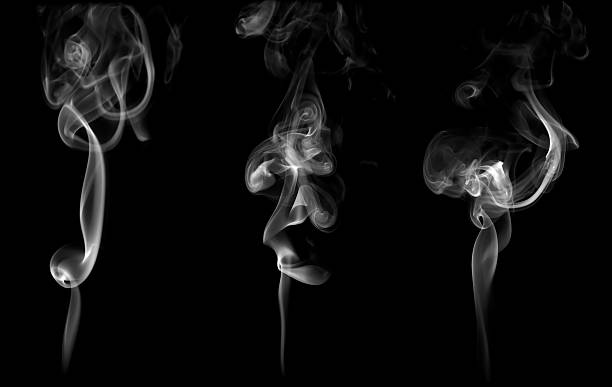 istock White smoke rising and swirling on black background, creating elegant abstract patterns and smooth flow. Perfect for concepts of mystery, fire, vapor, incense, meditation, or artistic digital design. 2243222671