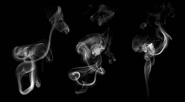 istock White smoke swirl isolated on black background, showing abstract flowing patterns and smooth texture. Ideal for mystery, fire, vapor, incense, or artistic design concepts in advertising and digital 2243222674