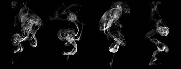 istock White smoke trails isolated on black background with abstract swirling patterns and smooth movement. Perfect for concepts of mystery, vapor, fire, incense, meditation, or elegant digital and design. 2243222720