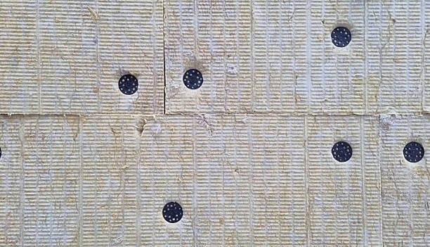 istock A detail of wall pressed thermal insulation materials,  and attached with dowels 2243224405