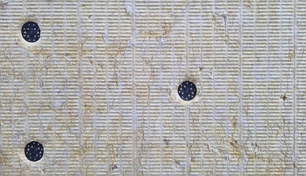 istock A detail of wall pressed thermal insulation materials,  and attached with dowels 2243224414