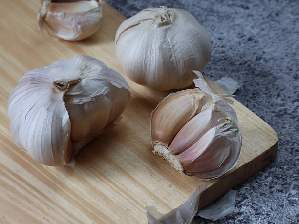 istock Fresh bulb and garlic cloves on grey background 2243226667
